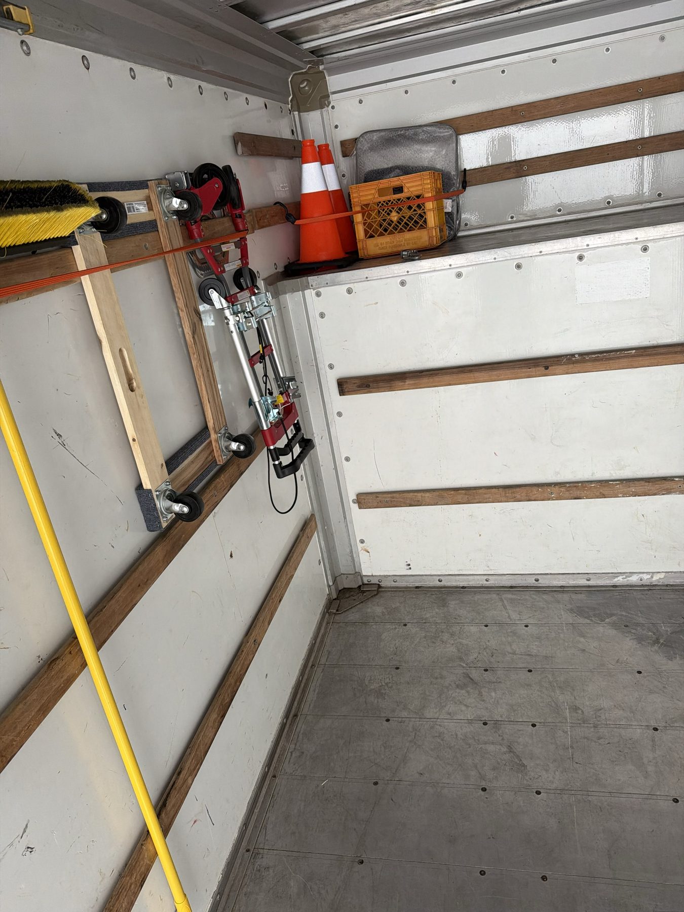 Tailwind Movers truck interior with dollies and equipment organized and ready